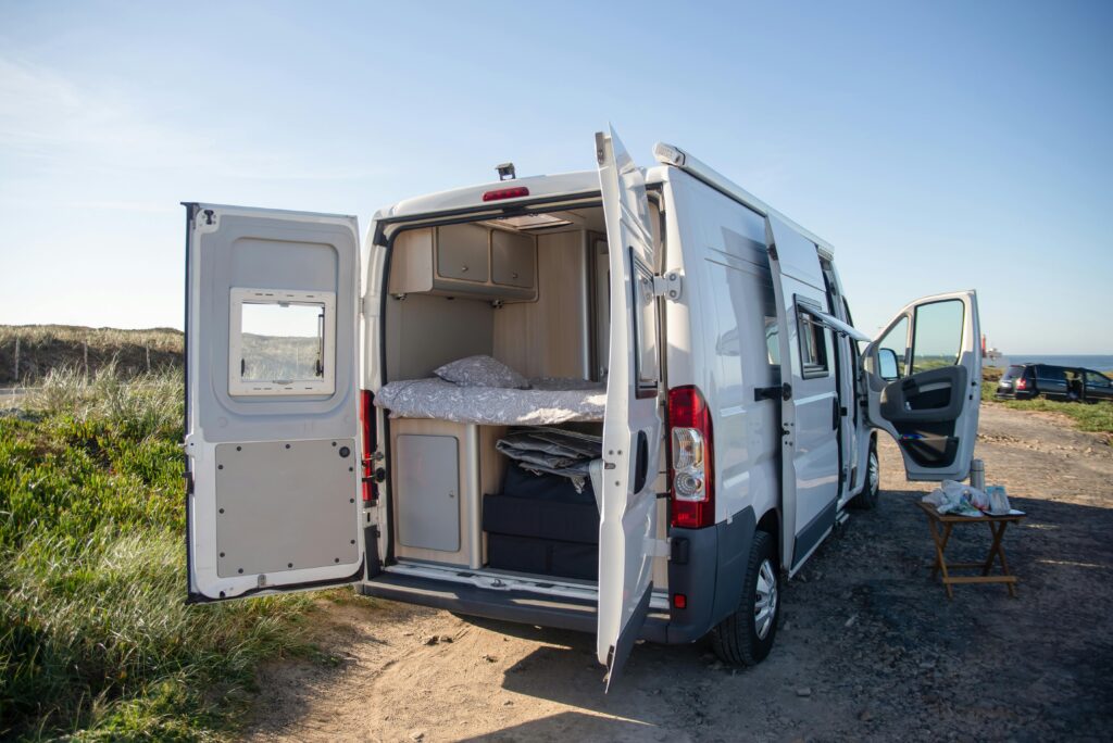 Explore the open road with this cozy campervan setup by the Portuguese coast.